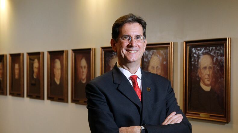 University of Dayton President Daniel Curran’s last day on the job on June 30, 2016. LISA POWELL /STAFF