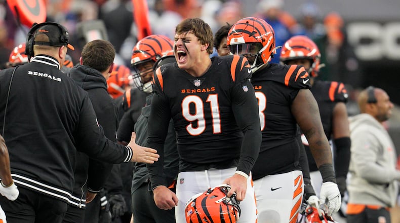 Cincinnati Bengals defensive end Trey Hendrickson (91) celebrates a sack as he comes to the sideline in the second half of an NFL football game against the Indianapolis Colts in Cincinnati, Sunday, Dec. 10, 2023. (AP Photo/Jeff Dean)