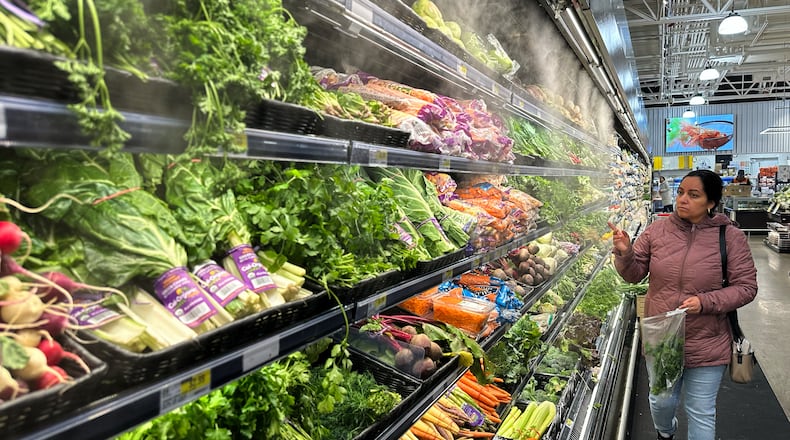 FILE - A person shops at a grocery store in Schaumburg, Ill., Monday, Feb. 9, 2026. (AP Photo/Nam Y. Huh, File)
