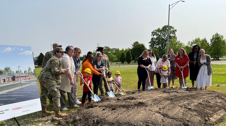 Employees and children gather to ceremonially break ground for a new $38 million child development center on Wright-Patterson Air Force Base Tuesday June 3, 2025. THOMAS GNAU/STAFF