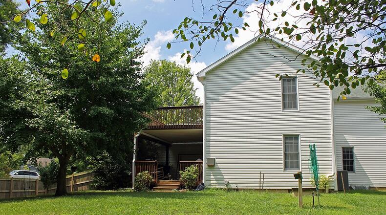 The main bedroom boasts an exterior door that opens to the second-floor deck.
