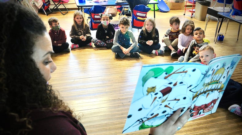 Karly Douglas, a kindergarten teacher at Haywood Elementary in Troy, reads a story to her class on Monday, January 3, 2022. MARSHALL GORBY \STAFF