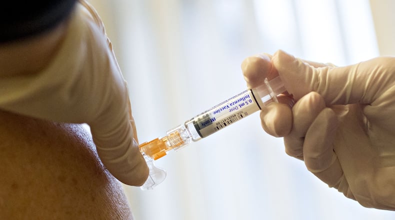 A nurse administers a flu shot in Princeton, Illinois, on Oct. 12, 2017. Photo: Daniel Acker/Bloomberg