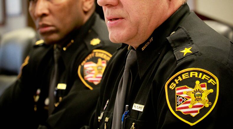 Montgomery County Sheriff Phil Plummer, foreground, and Major Daryl Wilson at a press conference last year. A mother and daughter who worked in the sheriff’s office are no longer with the department after a pending criminal investigation. FILE