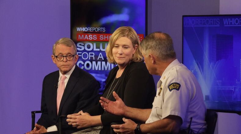 Ohio Gov. Mike DeWine appears with Dayton Mayor Nan Whaley and Police Chief Richard Biehl. STAFF/BILL LACKEY