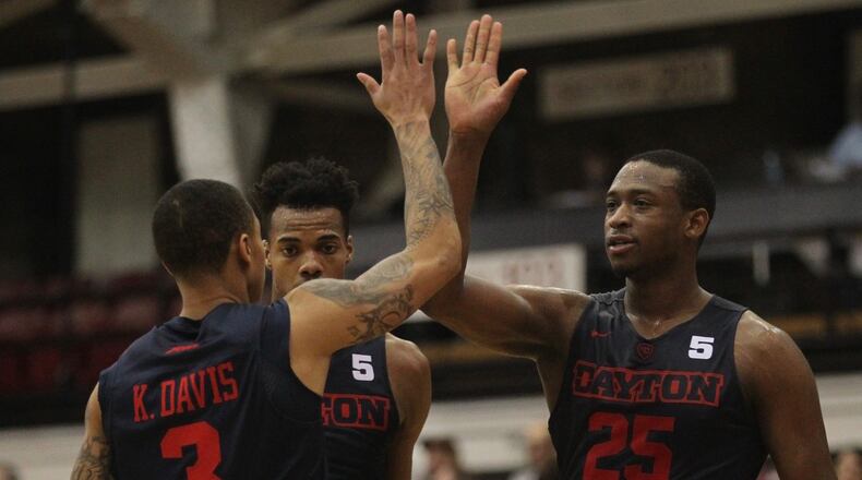 Dayton's Kendall Pollard slaps hands with Kyle Davis after a basket in the second half against Fordham on Tuesday, Jan. 31, 2017, at Rose Hill Gym in Bronx, N.Y.