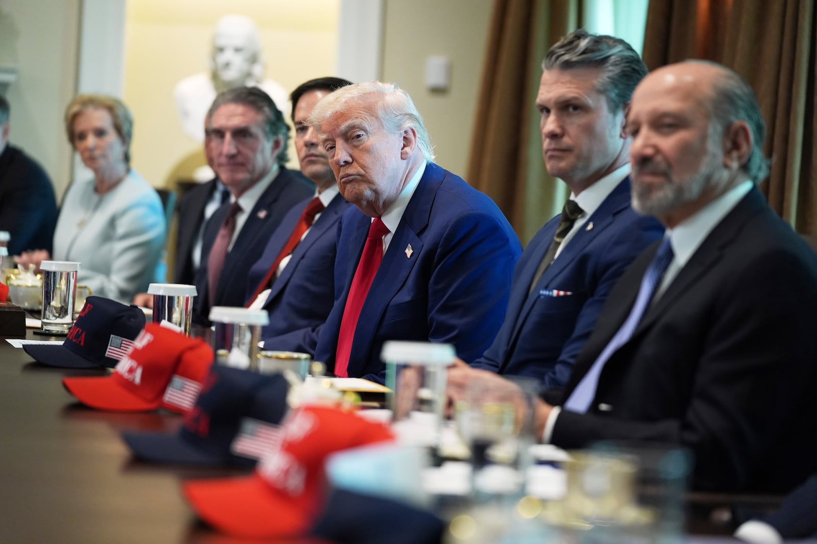 President Donald Trump listens during a cabinet meeting at the White House, Wednesday, April 30, 2025, in Washington. (AP Photo/Evan Vucci)