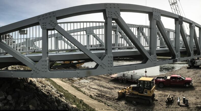 The pedestrian bridge that connects Deeds Point and RiverScape is scheduled to be complete this spring. JIM NOELKER/STAFF