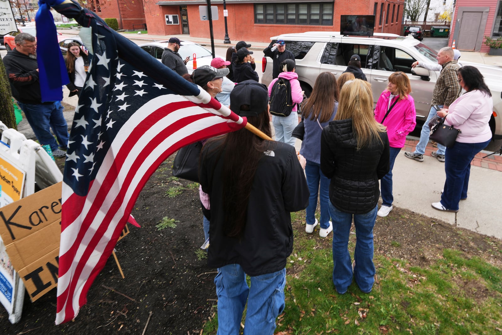 Supporters of Karen Read gather outside a buffer zone and watch Read's trial at Norfolk Superior Court, Tuesday, April 22, 2025, in Dedham, Mass. (AP Photo/Charles Krupa)