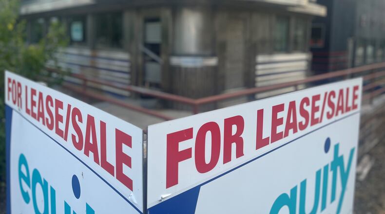 A for lease/sale sign in front of 101 S. St. Clair St. in downtown Dayton. The building was once a nightclub and a diner before that but it has been empty for years. CORNELIUS FROLIK / STAFF