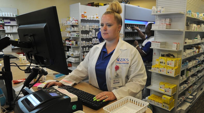 Desiree Mabe, a Pharmacy Tech at ZIKS Family Pharmacy, works on filling prescriptions, Tuesday July 27, 2021. MARSHALL GORBY\STAFF