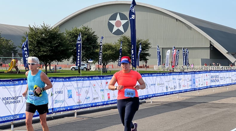 Runners approach the finish line of Saturday's U.S. Air Force Marathon, with the Air Force Museum in the background. AIMEE HANCOCK/STAFF
