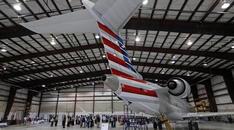 Dayton based PSA Airlines took delivery of its first Bombardier CRJ900 in this 2014 file photo at the Dayton International Airport. The then-new jet features 76 seats, 12 of them are business class. TY GREENLEES / STAFF