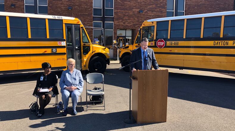U.S. EPA Chief of Staff Kurt Thiede announces grant funding Oct. 28, 2019, to help Dayton Public Schools buy more clean-diesel, lower-emissions buses. From left are DPS Associate Superintendent Shelia Burton, and Carolyn Watkins, the Ohio EPA’s chief of the office of environment education. JEREMY P. KELLEY / STAFF