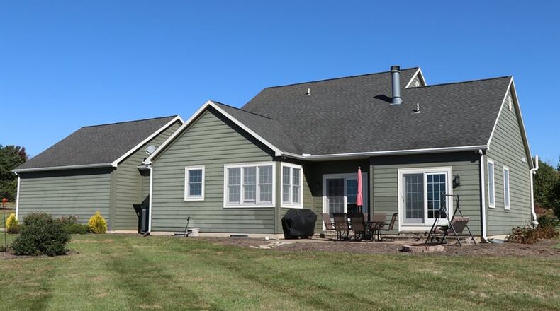 Patio doors open from the great room to the paver-brick, rear patio.