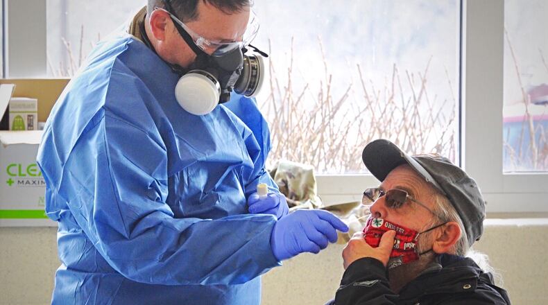 Bo Nash, drove from Dayton Tuesday, Dec. 15, 2020 to the old Greene County Career Technology Center to be tested for COVID-19. The tests were free to anyone.
