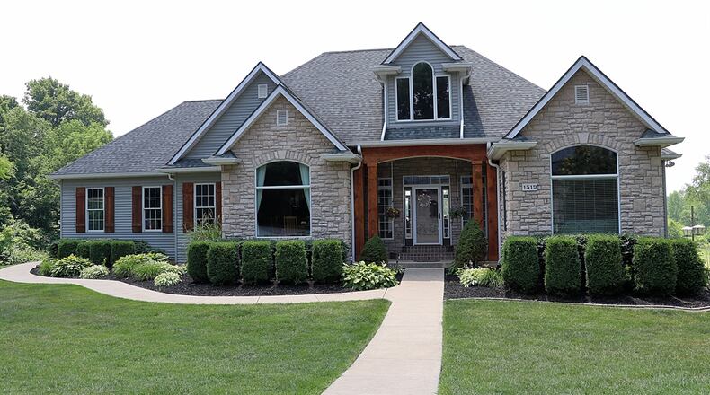 Listed for $1,275,000 by Irongate Inc. Realtors, the stone, cedar and vinyl ranch at 1519 Kingsway Drive has about 5,400 square feet of living space — including a full walk-out lower level. Contributed photos by Kathy Tyler