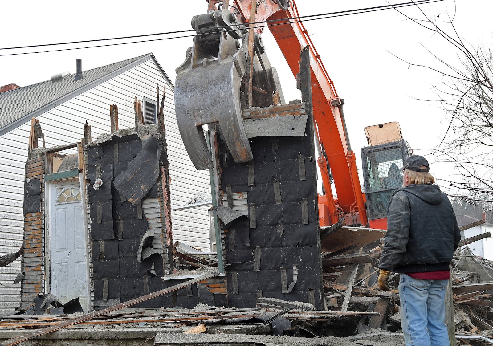 A crew from Tony Smith Wrecking demolishes a house on East Columbia Street in this file photo. Bill Lackey/Staff