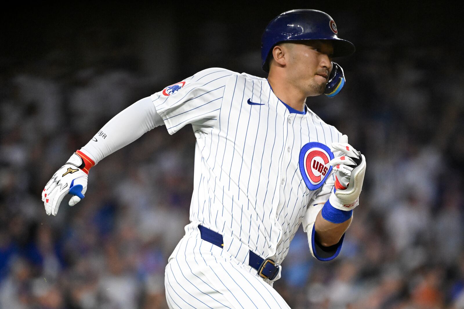 Chicago Cubs' Seiya Suzuki runs to first base after he hits a home run during the sixth inning of a baseball game against the Cleveland Guardians, Tuesday, July 1, 2025, in Chicago. (AP Photo/Matt Marton)
