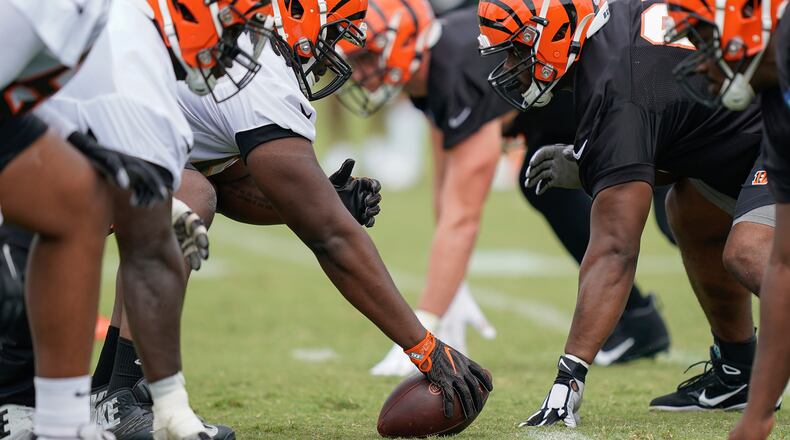 Cincinnati Bengals players line up to run a play during NFL football training camp, Monday, July 29, 2019, in Cincinnati. (AP Photo/Bryan Woolston)