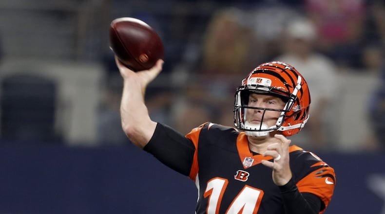 Cincinnati Bengals quarterback Andy Dalton (14) completes a pass in the first quarter against the Cowboys on Saturday, Aug. 18, 2018 at AT&T Stadium in Arlington, Texas. (Bob Booth/Fort Worth Star-Telegram/TNS)