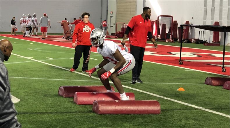 Ohio State true freshman Zach Harrison works out on the first day of spring football in Columbus.