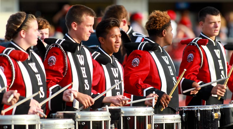 Wayne High School Marching Band plays on the sideline during the season opening double header game night at Wayne Stadium. JIM WITMER/STAFF