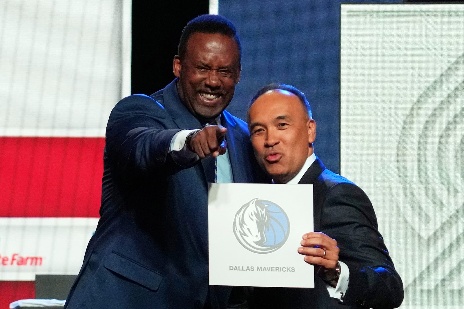 Dallas Mavericks' Rolando Blackman, left, and NBA Deputy Commissioner Mark Tatum pose for photos after Tatum announced that the Mavericks had won the first pick in the NBA basketball draft lottery in Chicago, Monday, May 12, 2025. (AP Photo/Nam Y. Huh)