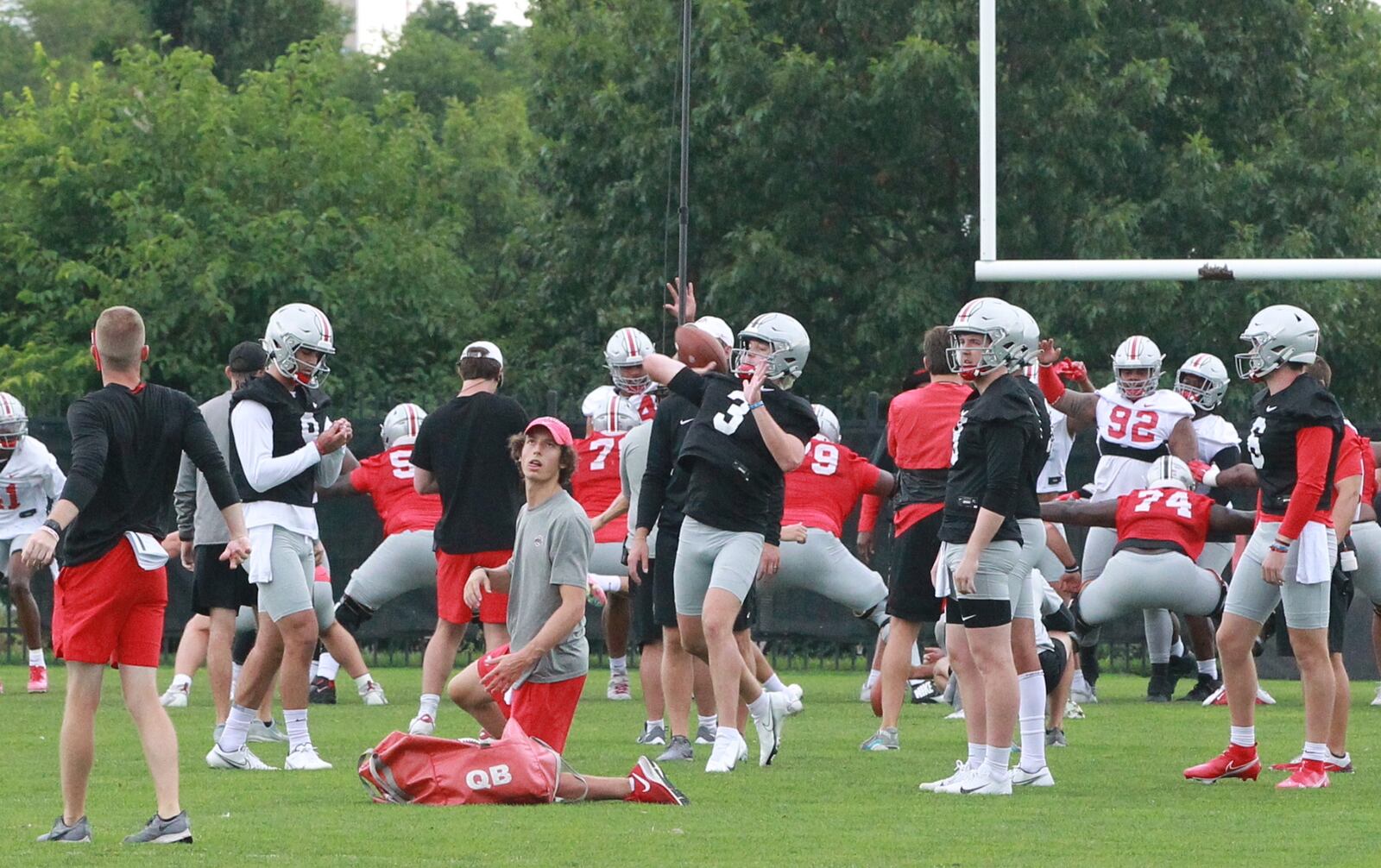 Quinn Ewers throws a pass at Ohio State Buckeyes football practice in August of 2021. Marcus Hartman/STAFF