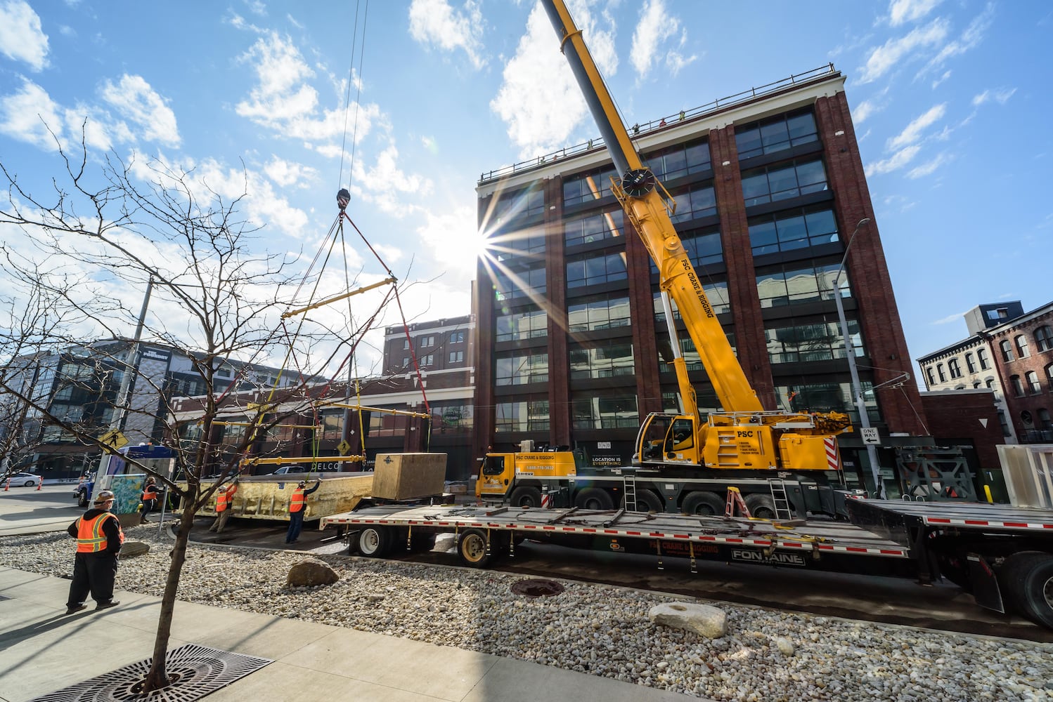 PHOTOS: Crane lifts swimming pool to The Delco's rooftop in downtown Dayton