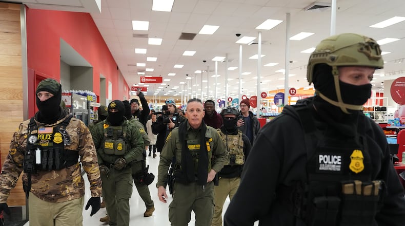 FILE - U.S. Border Patrol Cmdr. Gregory Bovino walks through a Target store Jan. 11, 2026, in St. Paul, Minn. (AP Photo/Adam Gray, File)