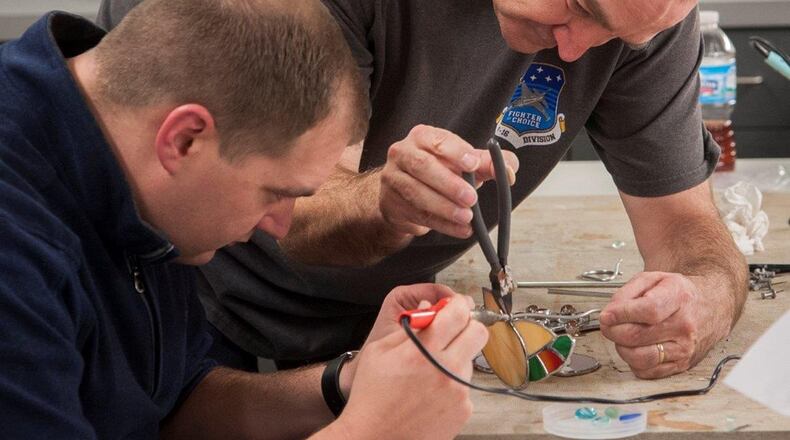 Participants take part in a stained-glass workshop at the Consolidated Hobby Complex on Wright-Patterson Air Force Base. A special holiday project themed class is scheduled for Dec. 9 from 10 a.m. to 3 p.m. Class participants will be able to choose from a variety of projects. (U.S. Air Force photo/Jim Varhegyi)