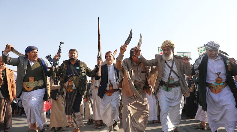 Houthi supporters dance as they celebrate following the announcement that Israel and Hamas have agreed to the first phase of a peace plan to pause the fighting, in Sanaa, Yemen, Friday, Oct. 10, 2025. (AP Photo/Osamah Abdulrahman)