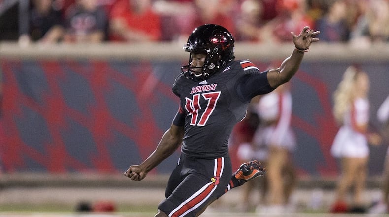 Louisville’s Jonathan Brown kick offs during a game against Murray State in 2014.