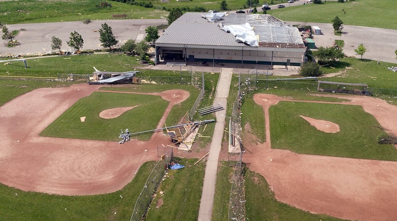 The Action Sports Center complex suffered extensive damage from a tornado on Monday night. Most of the roof was blown off. Light posts and fencing were flattened. TY GREENLEES / STAFF