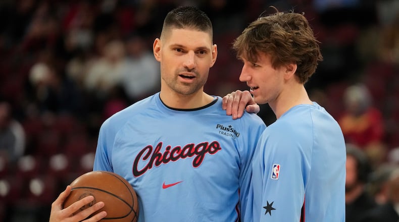 Chicago Bulls center Nikola Vucevic, left, and forward Matas Buzelis warm up before an NBA basketball game against the Miami Heat, Thursday, Jan. 29, 2026, in Chicago. (AP Photo/Erin Hooley)