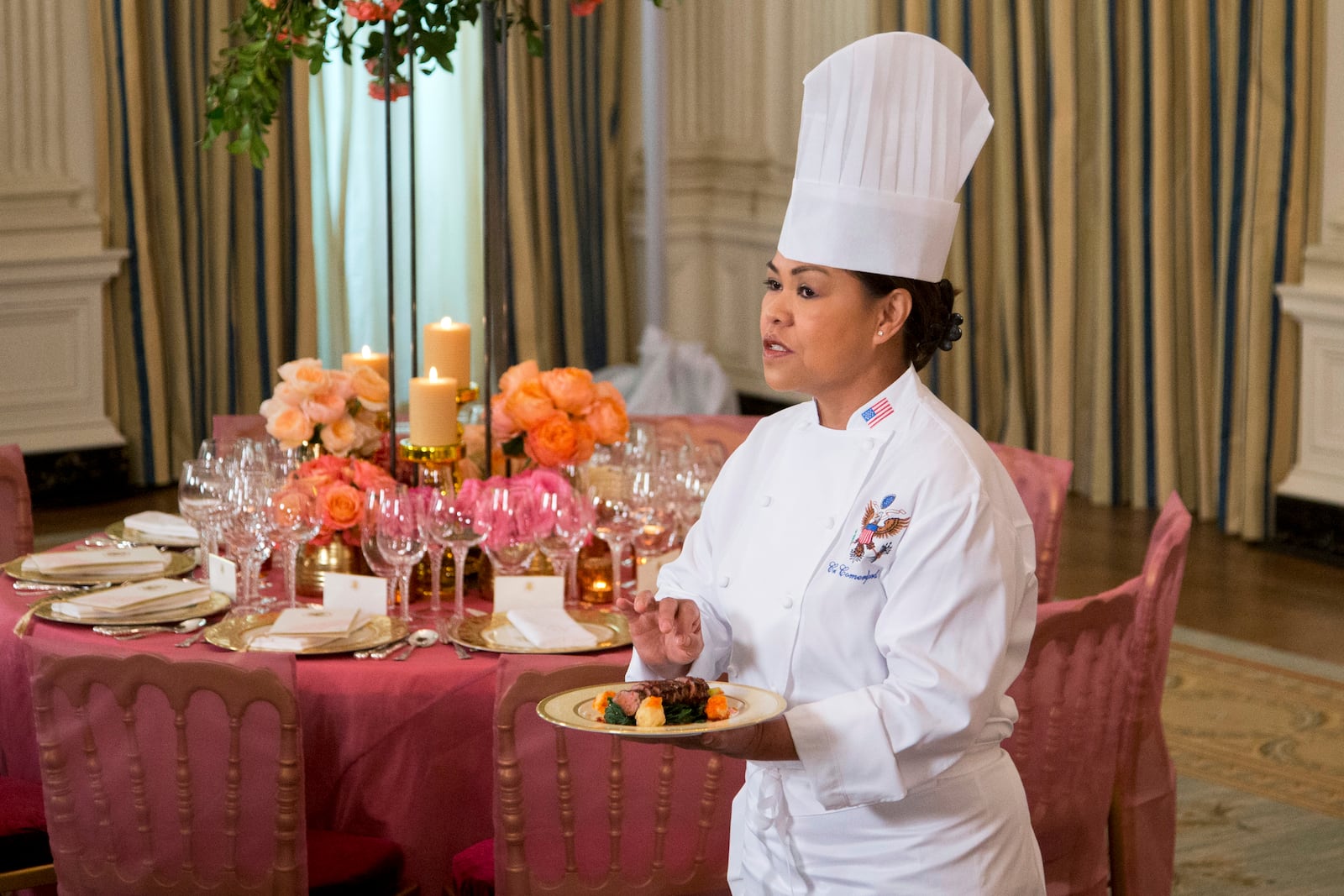 FILE - White House executive chef Cristeta Comerford shows the main course during a preview in the State Dining Room of White House in Washington, Sept. 24, 2015, for the state dinner of the visiting Chinese President Xi Jinping. (AP Photo/Manuel Balce Ceneta, File)