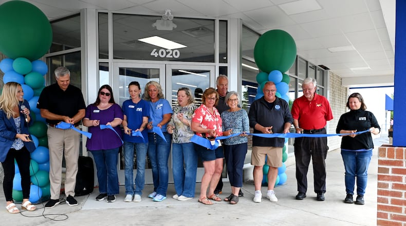 The new 24,000-square-foot St. Vincent de Paul thrift store and donation center in Hamilton replaces the former Pleasant Treasures indoor flea market. The newest SVDP thrift store and donation center is also its third-largest (the Western Hills and Milford stores are the first- and second-largest, respectively). Pictured is the ribbon cutting at the store on Thursday, Aug. 21, 2025, a day before it opened on Friday, Aug. 22, 2025. MICHAEL D. PITMAN/STAFF
