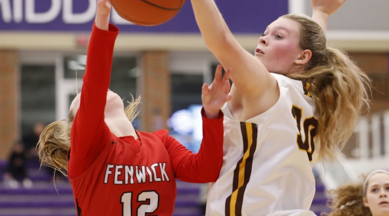 Alter's Maddie Moody defends a shot attempt by Fenwick's Madalyn Mahoney during their Division II girls district basketball semifinal Thursday, Feb. 17, 2022 at Middletown High School. Alter defeated Fenwick 59-34. NICK GRAHAM/STAFF