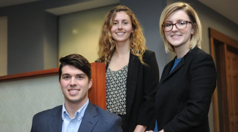 University of Dayton students John Seals, Lauren Wolford, left, and Colleen Sullivan, right, will compete in a global digital marketing competition hosted by Unilever in January. The students developed a social media campaign using Talenti brand gelato containers.