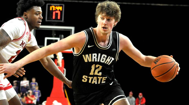 Wright State's AJ Braun, 12, drives toward the basket during a non-conference game against Miami in Oxford on Thursday, Dec. 22. DAVID A. MOODIE/CONTRIBUTING PHOTOGRAPHER