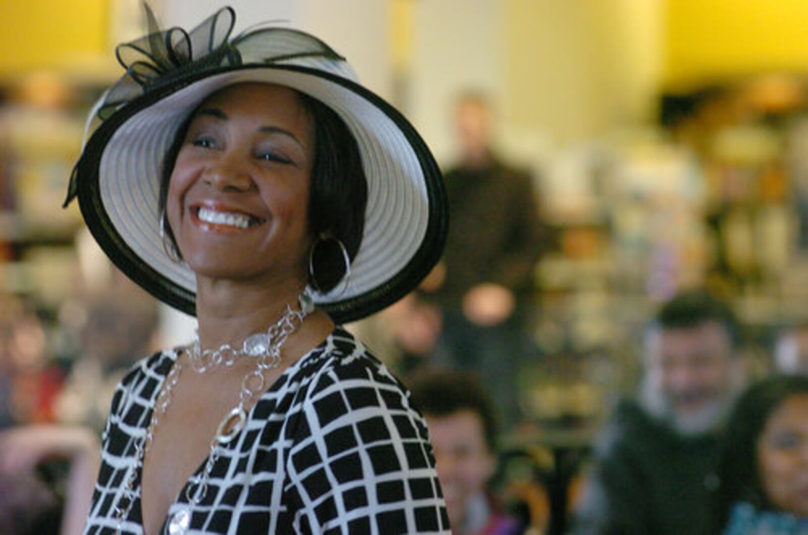 Archived photo: The Crowns Hat Show, Natasha Williams wearing a fashion design by Linda Crawford at the Books and Company for the 12th annual event at The Greene Town Center in Beavercreek on Saturday