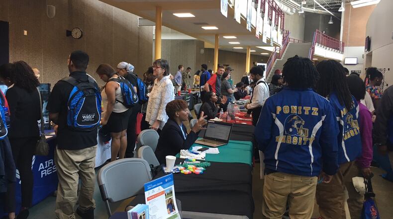 Students at Ponitz Career Tech Center in Dayton talk with local employers, colleges and military recruiters Thursday, May 3. JEREMY P. KELLEY / STAFF