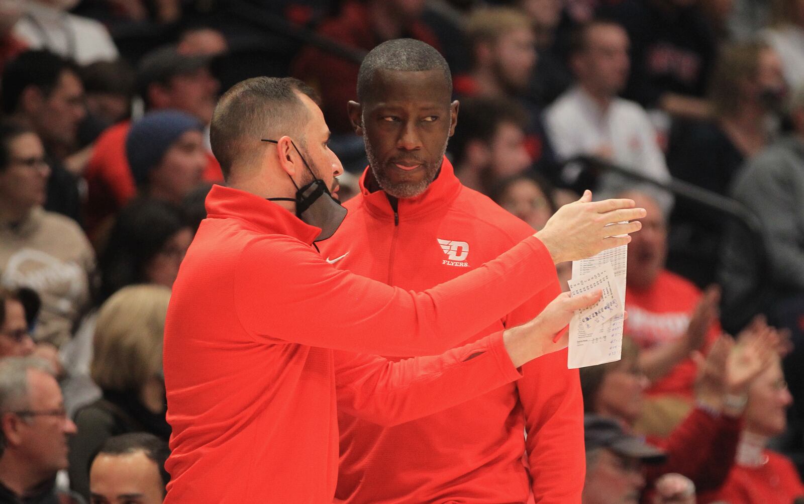 Dayton's James Kane talks to Anthony Grant during a game against Virginia Commonwealth on Wednesday, Jan. 5, 2022, at UD Arena. David Jablonski/Staff