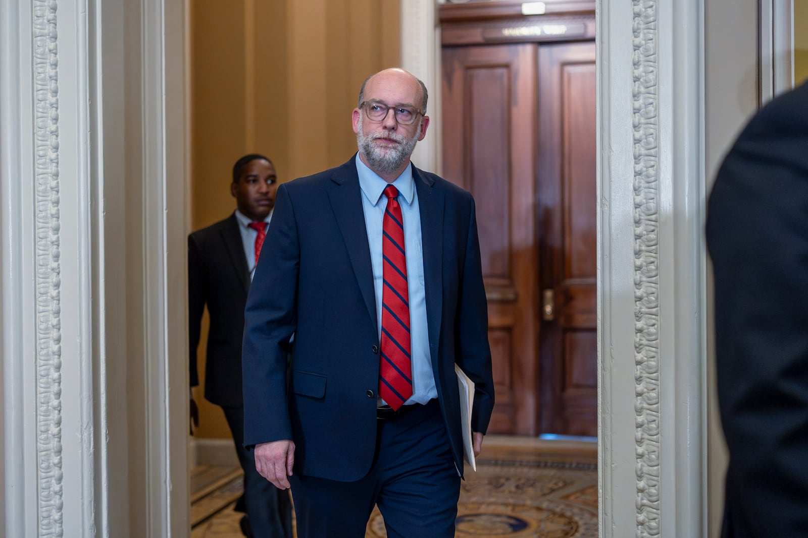 Office of Management and Budget Director Russell Vought, who's charged with implementing President Donald Trump's policies and agendas, arrives to meet with Republican senators at the Capitol in Washington, Tuesday, July 15, 2025. (AP Photo/J. Scott Applewhite)