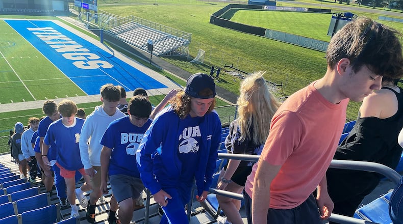 Miamisburg High School students walk up and down the bleachers at Holland Field during the school's second annual 9/11 Stair Climb on Friday, Sept 9, 2022. The event was organized by Siobhan Tirado, an MHS intervention specialist with a focus on history, and social studies teacher Katie Lay. ERIC SCHWARTZBERG/STAFF