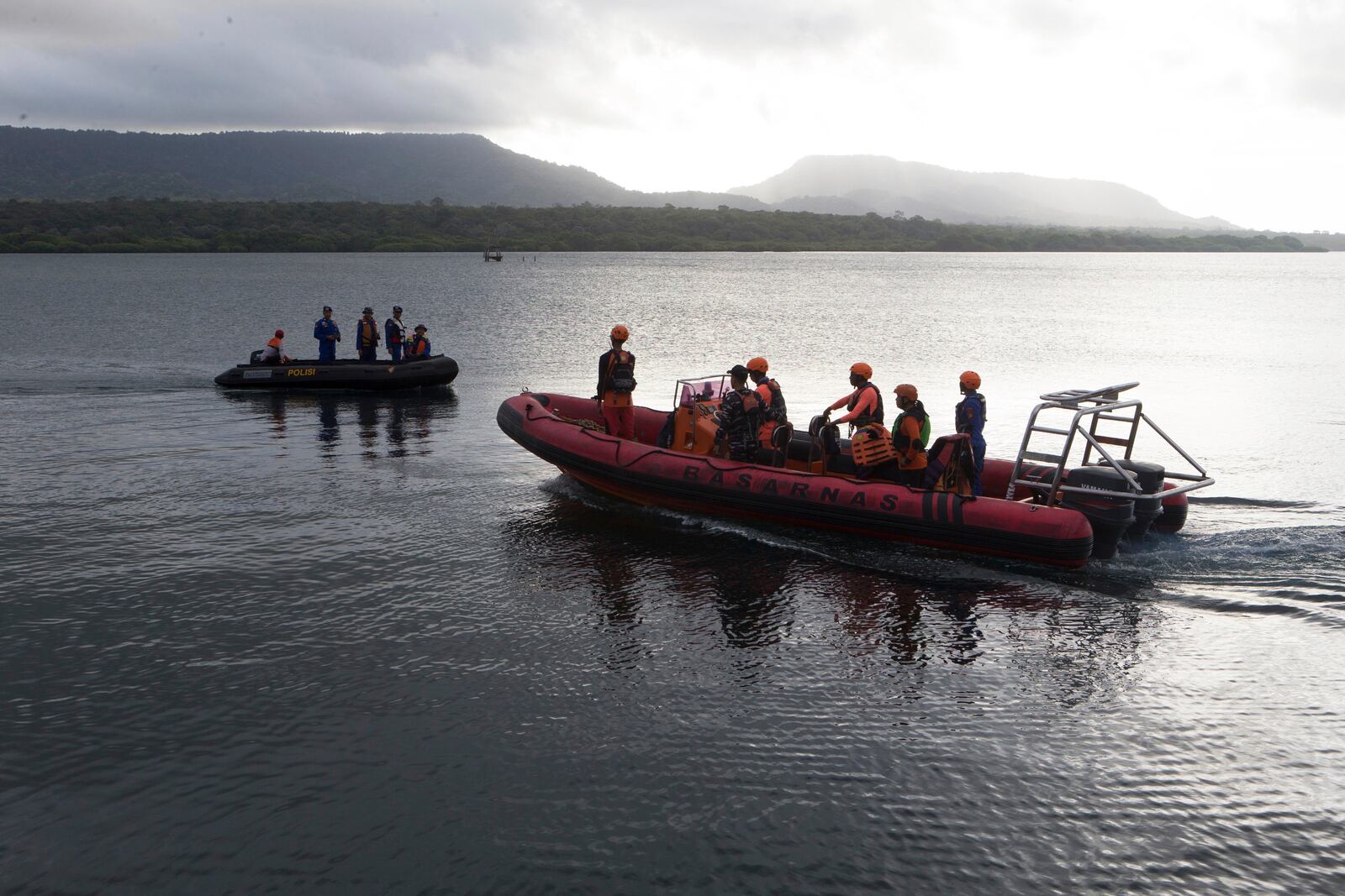 Rescuers search for victims after a ferry sank in the waters off Jembrana, Bali, Indonesia, Friday, July 4, 2025. (AP Photo/Firdia Lisnawati)