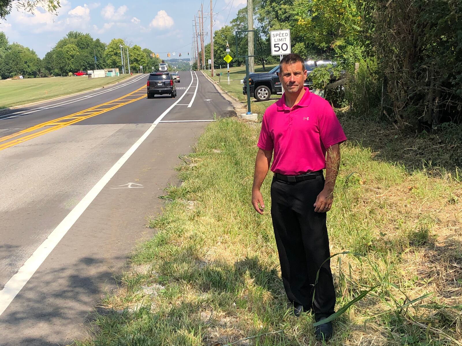 Ed Standifer stands along Ohio 741, near his home, where a new subdivision entrance is to be built.