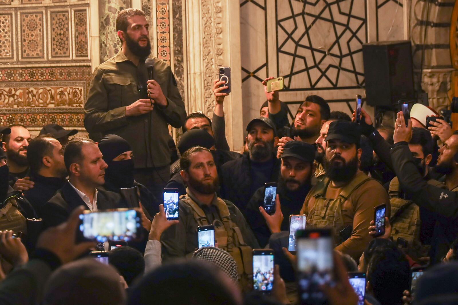 FILE - Abu Mohammed al-Golani speaks at the Umayyad Mosque in Damascus after toppling Bashar Assad's government on Dec. 8, 2024. (AP Photo/Omar Albam)