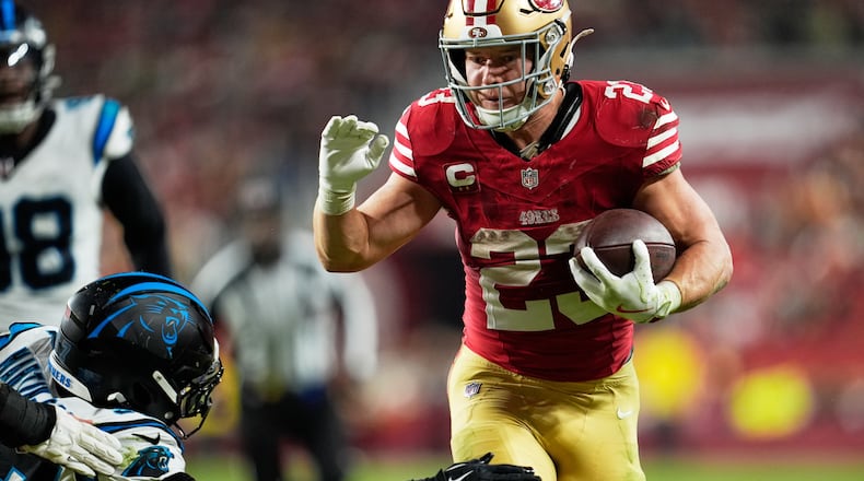 San Francisco 49ers running back Christian McCaffrey runs for a touchdown against the Carolina Panthers during the second half an NFL football game, Monday, Nov. 24, 2025, in Santa Clara, Calif. (AP Photo/Godofredo A. Vásquez)